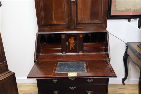 An 18th century Dutch inlaid mahogany double dome top bureau bookcase, W.3ft 4in. D.1ft 9in. H.6ft 10in.